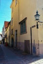 Old medieval Narrow Street in Tallinn with a lantern on the wall, Estonia Royalty Free Stock Photo